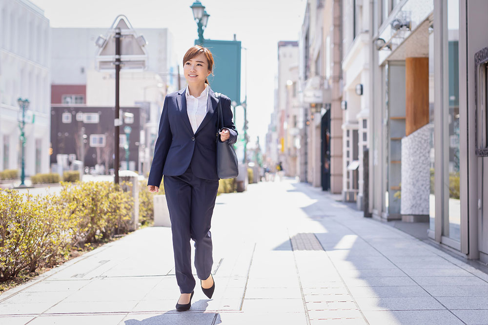 Business woman walking on the street