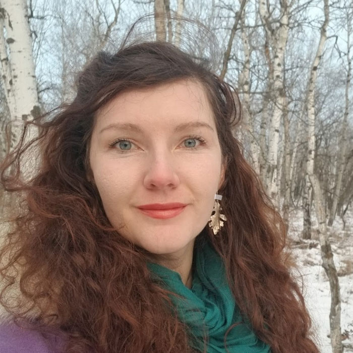 Anneliese Schoppe smiling with trees in background