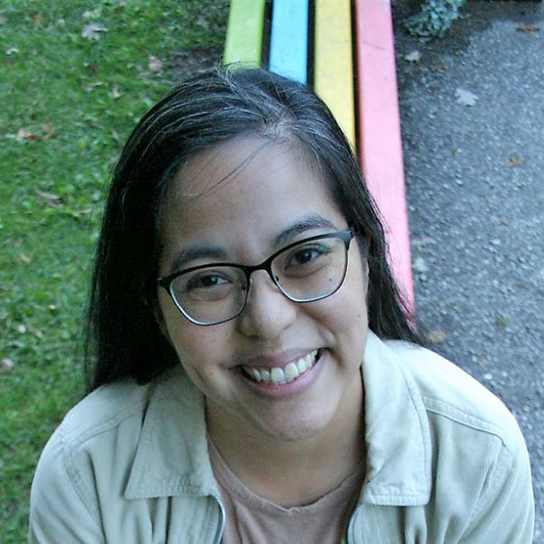 Daisydee Bautista seated outside