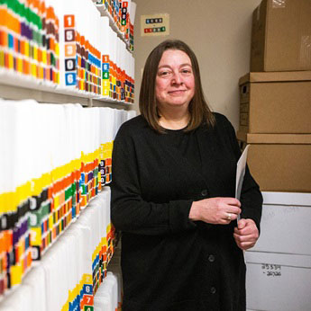 Jennifer Bogoch standing with folder in hand