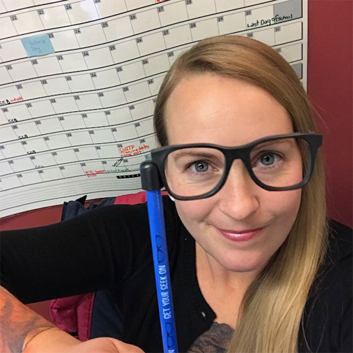 Lani Zastre sitting with calendar in background